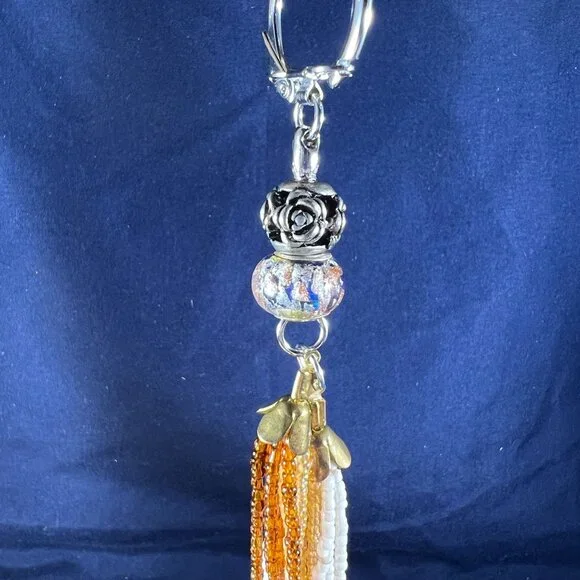 Beaded Keychain Bag Charm With Orange & White Tassels And Silver Floral Accent - Picture 2 of 4